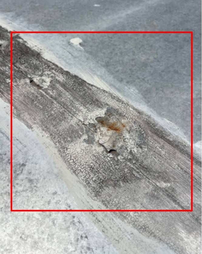 Back-tray joint with failed sealant marked in red