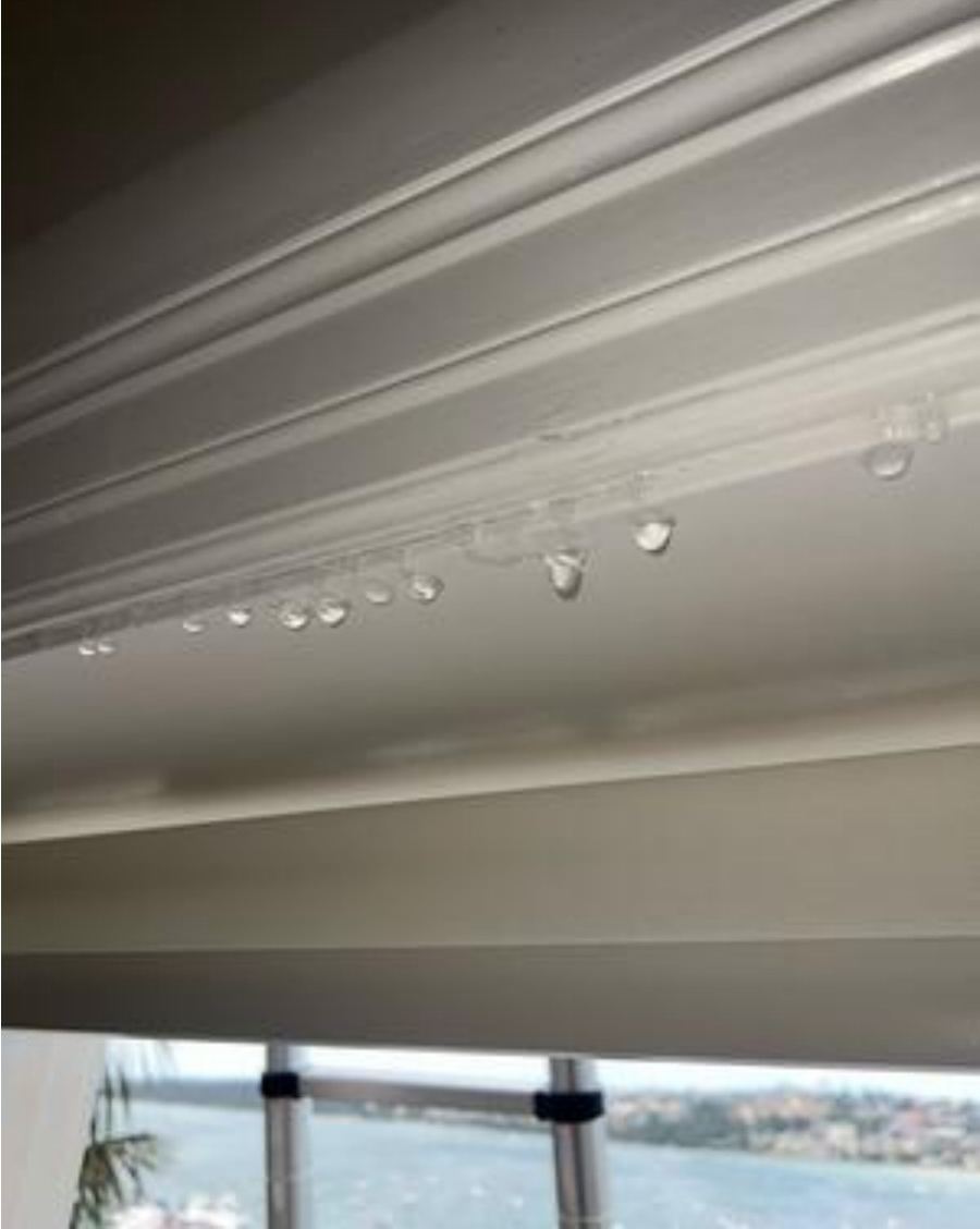 Water droplets forming along the inside of a door head